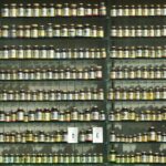 assorted labeled bottle on display shelf