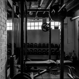 exercise equipments in grayscale photography